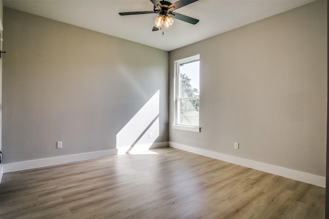 unfurnished room with ceiling fan and light hardwood / wood-style flooring