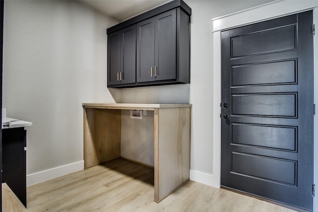 laundry room with washer hookup and light wood-type flooring