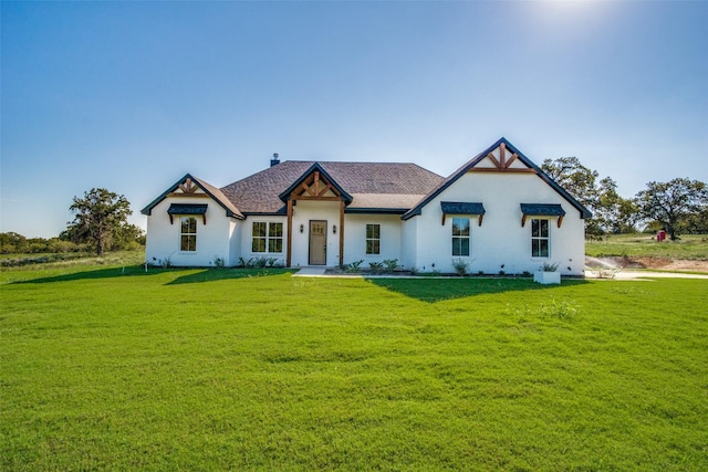 view of front of home with a front lawn