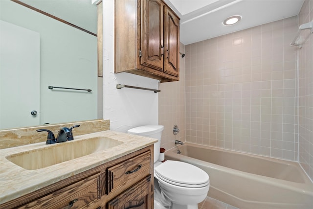 full bathroom with tiled shower / bath combo, vanity, and toilet