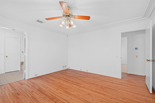 empty room featuring ceiling fan, ornamental molding, and light hardwood / wood-style flooring