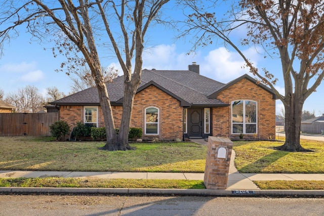 ranch-style home featuring a front yard