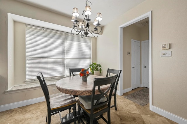 dining space with a chandelier