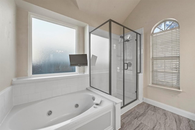 bathroom with vaulted ceiling and plus walk in shower