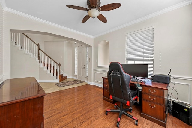 office space with ornamental molding, ceiling fan, and wood-type flooring