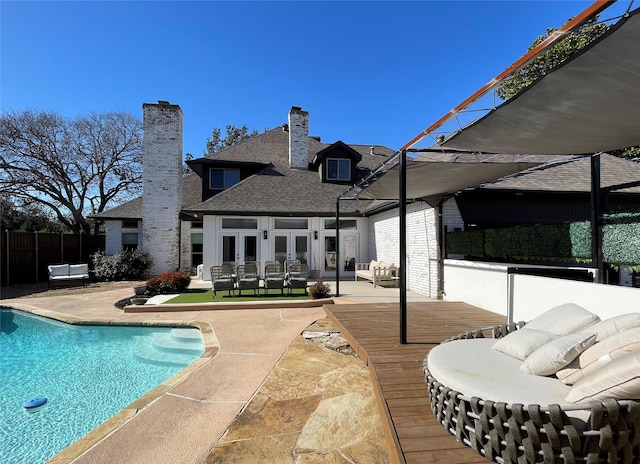 exterior space featuring an outdoor living space, a patio, and a wooden deck