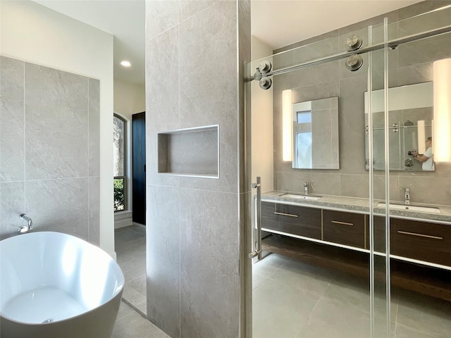 bathroom featuring tile walls, vanity, plenty of natural light, and tile patterned floors