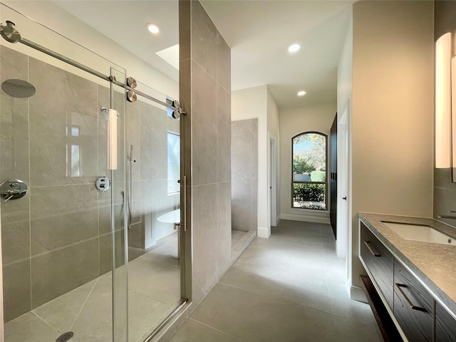 bathroom featuring vanity and shower with separate bathtub