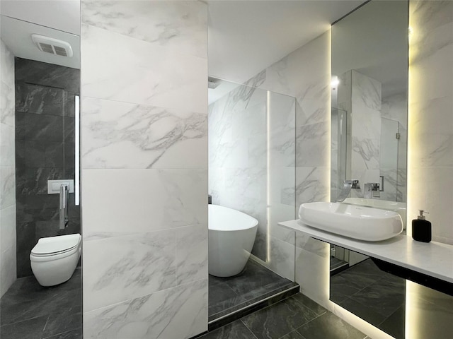 bathroom featuring sink, toilet, and a bathing tub