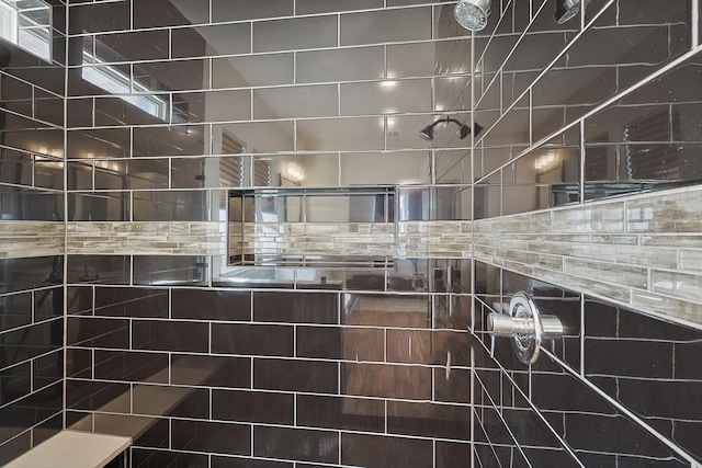 interior details with a tile shower