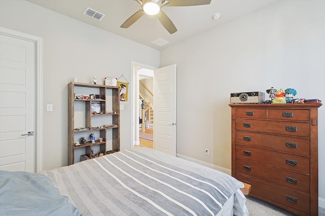 bedroom featuring light colored carpet and ceiling fan