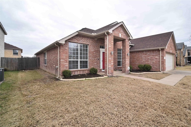 view of front of home featuring a garage and a front yard