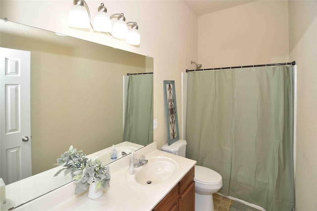 bathroom featuring vanity, toilet, and a shower with shower curtain