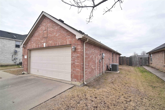 garage with cooling unit and a lawn