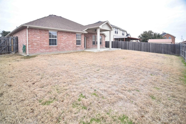 view of front of home with a front lawn and a patio area