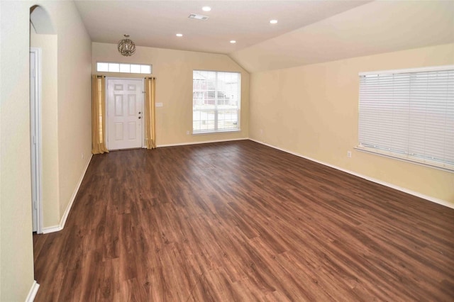 interior space featuring dark hardwood / wood-style floors and vaulted ceiling