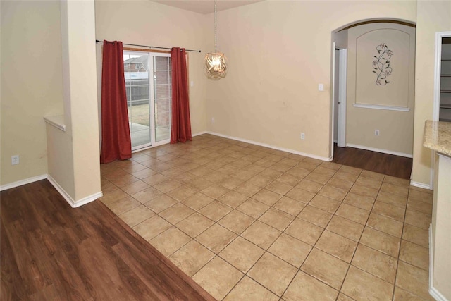 spare room featuring light wood-type flooring