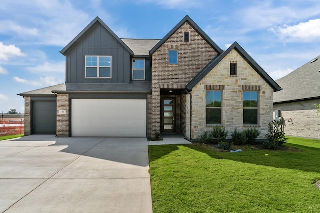 view of front of home featuring a garage and a front yard