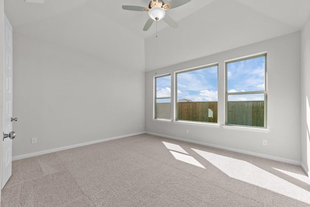 carpeted empty room with lofted ceiling and ceiling fan