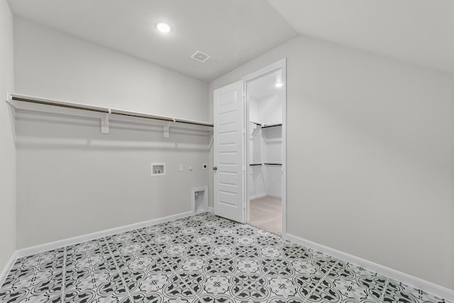 spacious closet featuring vaulted ceiling