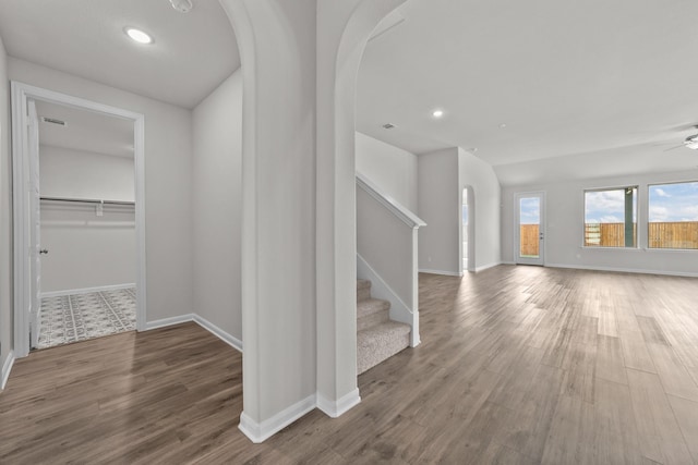 hallway with wood-type flooring