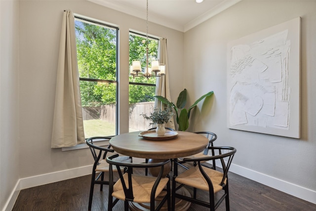 dining space with crown molding and dark hardwood / wood-style floors