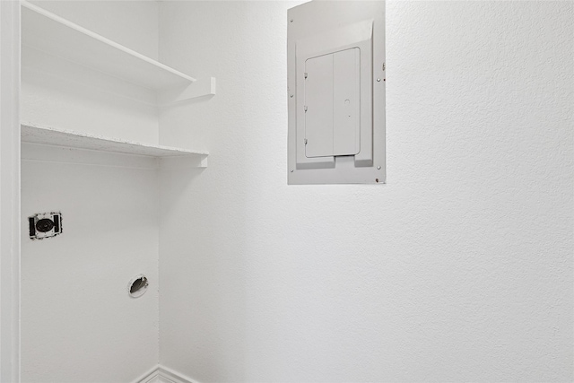 washroom with hookup for an electric dryer and electric panel