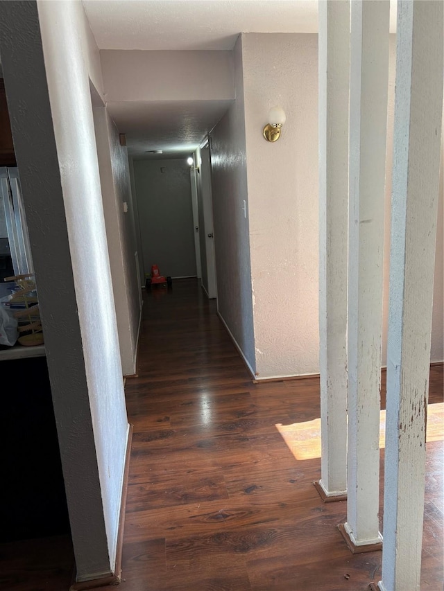 hallway with dark wood-type flooring