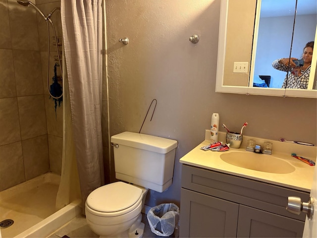 bathroom with vanity, toilet, and a shower with shower curtain