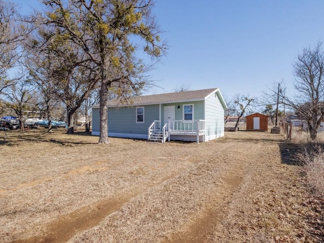 view of front of house with a storage unit