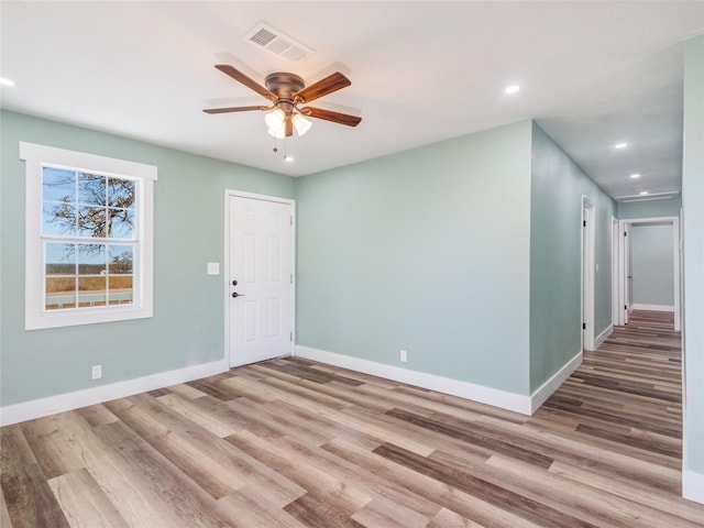 entrance foyer with ceiling fan and light hardwood / wood-style floors