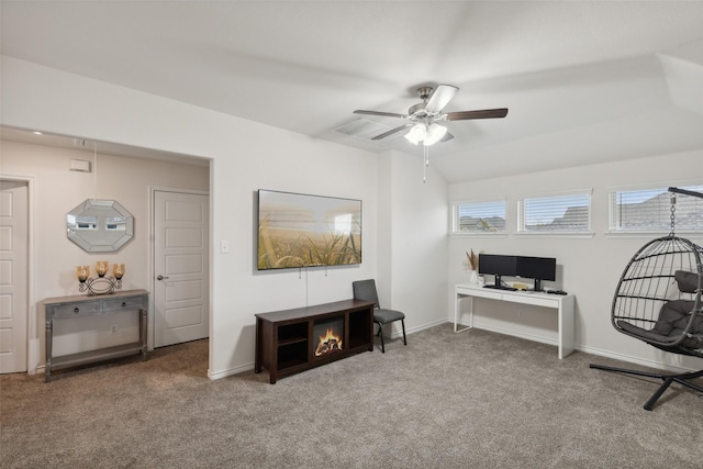 carpeted office featuring lofted ceiling and ceiling fan