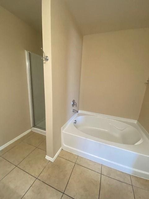 14029 Coyote Trl, Fort Worth, TX 76052 - bathroom featuring tile patterned floors, baseboards, a shower stall, and a bath