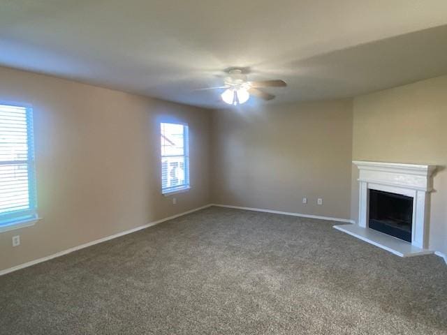 14029 Coyote Trl, Fort Worth, TX 76052 - unfurnished living room with baseboards, carpet flooring, ceiling fan, and a fireplace with raised hearth