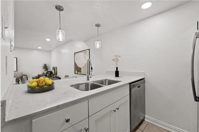 kitchen with sink, hanging light fixtures, kitchen peninsula, dishwasher, and white cabinets