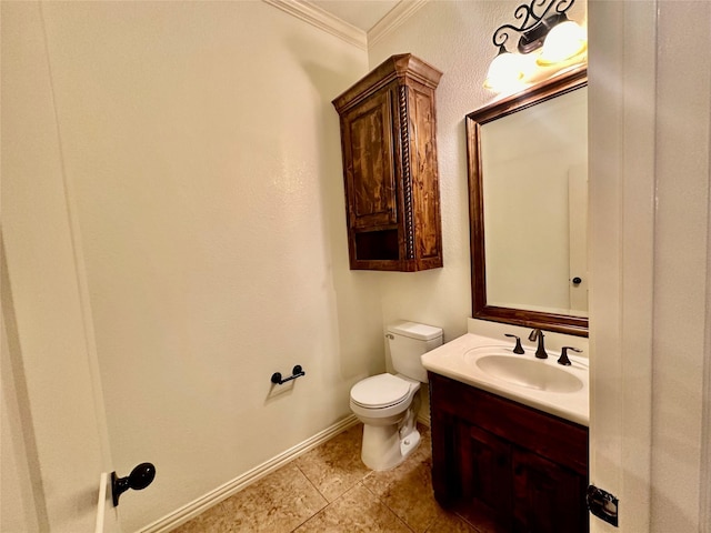 bathroom featuring vanity, tile patterned flooring, crown molding, and toilet