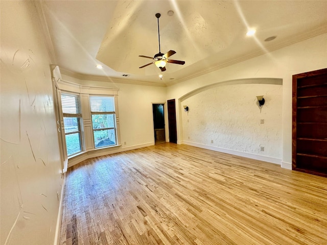 empty room featuring crown molding, ceiling fan, and light hardwood / wood-style flooring