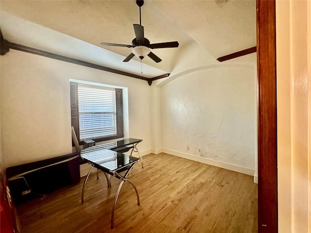 office area with vaulted ceiling, light hardwood / wood-style floors, and ceiling fan