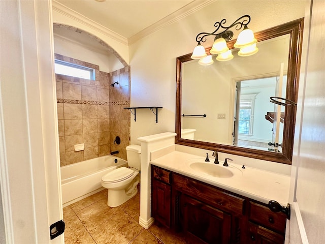 full bathroom featuring tile patterned floors, toilet, crown molding, vanity, and tiled shower / bath combo