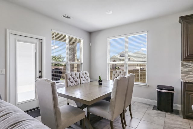 dining area featuring light tile patterned floors