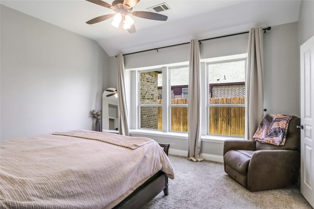 carpeted bedroom with ceiling fan and lofted ceiling