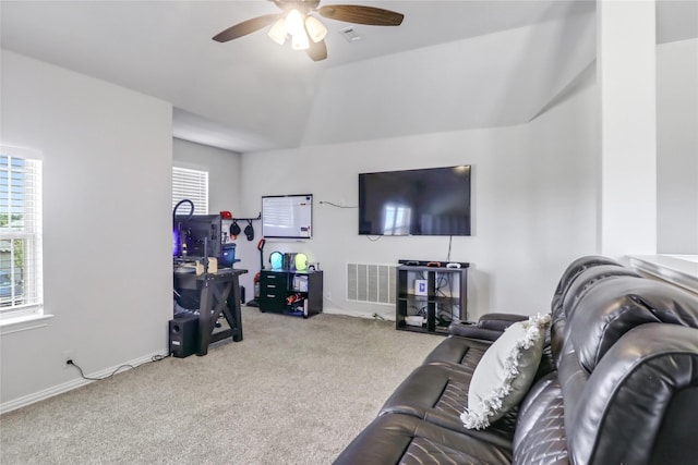 living room with ceiling fan, light colored carpet, and lofted ceiling