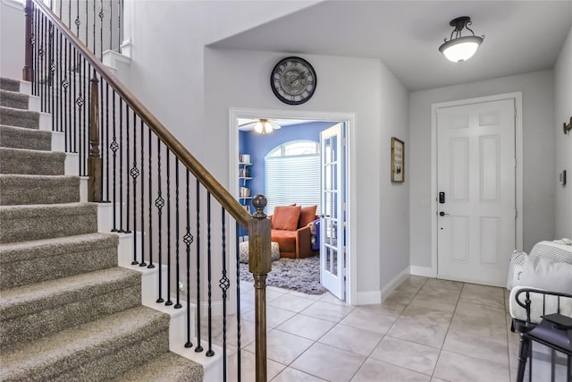 entrance foyer with light tile patterned floors