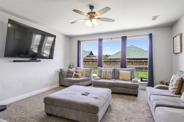 living room with light colored carpet and ceiling fan