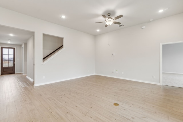 unfurnished room featuring ceiling fan and light wood-type flooring