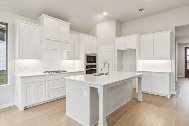 kitchen featuring white cabinetry, sink, a kitchen island with sink, and stainless steel appliances