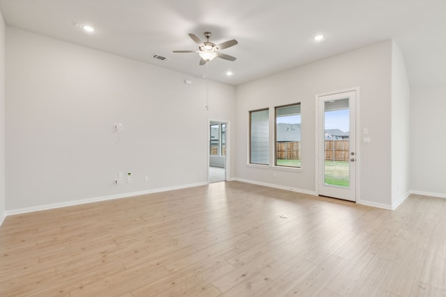 empty room featuring ceiling fan and light hardwood / wood-style floors