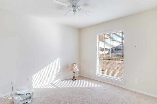 carpeted empty room with ceiling fan