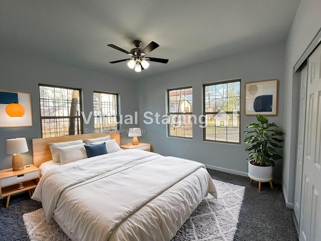 carpeted bedroom featuring ceiling fan, a closet, and multiple windows