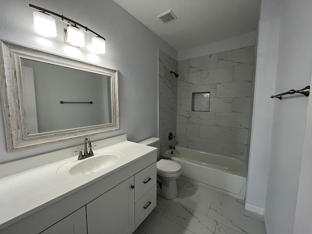 full bathroom featuring vanity, toilet, and tiled shower / bath